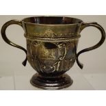 An early George II silver horse racing trophy cup, the bell shaped part fluted body, with a leaf
