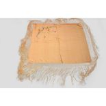 Two Chinese silk shawls and an Indian stole, circa 1920s-30s, the first an ivory silk shawl, 62in. x
