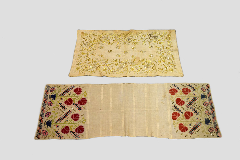 Two Ottoman pieces, both early 20th century, the first a Turkish towel, 50in. x 16in. 127cm. x 41cm.