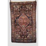 Inscribed Hamadan rug, north west Persia, circa 1930s, 6ft. 11in. x 4ft. 3in. 2.11m. x 1.30m.