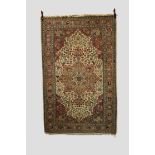 Anatolian(?) rug, second half 20th century, 7ft. 6in. x 4ft. 10in. 2.29m. x 1.47m. Ivory cartouche