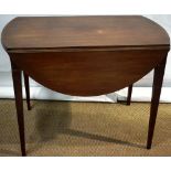 A Sheraton mahogany Pembroke table, the oval drop leaf top above a bow fronted frieze drawer each