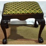 A late Nineteenth century mahogany Chippendale style stool, with a rectangular drop in seat, the