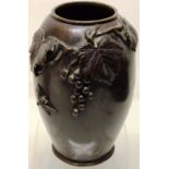 A late nineteenth century Chinese bronze vase, the body applied a grape-vine, with an insect, 9in (