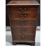 A George III mahogany veneered tall narrow chest of five graduated drawers, with brass locks and