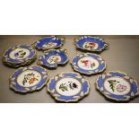 A William IV porcelain dessert service, each painted a different flower, raised pale blue borders