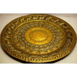 A Burmese late nineteenth century circular brass tray, a central lotus flower head, with repouse