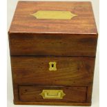 An early nineteenth century mahogany apothecaries box, the hinged lid reverse glass bottles with