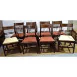 A set of eight mahogany dining chairs, the backs reeded with veneered banded crests and horizontal