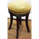 A Regency mahogany piano stool, the revolving seat upholstered faded green velvet, on an