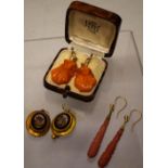 A pair of nineteenth century Italian micro mosaic gilt mounted oval earrings, a pair of carved coral
