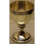 A Regency silver wine goblet, the bowl engraved with a border of trailing foliage on a pedestal