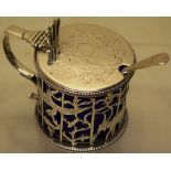 An early Victorian silver circular mustard pot, the pierced fretwork sides engraved with a pheasant,