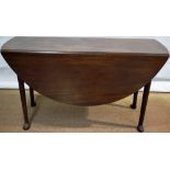 A large mid eighteenth century Irish Cuban mahogany gateleg table, the slightly oval top, on plain