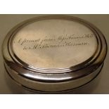 An early George II silver oval tobacco box, the cover with a presentation inscription, 4in (10cm)