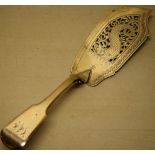 A George IV silver fiddle pattern fish slice, engraved initials, the pierced blade engraved with a