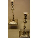 A pair of early George III cast silver candlesticks, with gadroon borders, the baluster knopped