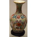 A small nineteenth century Cantonese porcelain small vase, with panels of famille rose and verte