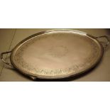 A George III silver oval tray, the centre with a vacant foliage cartouche, the border engraved