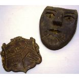 An early nineteenth century carved oak boss, of a Coat of Arms, 7.25in (18.5cm) x 6.5in (16.5cm) and