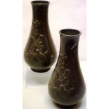 A pair of nineteenth century Chinese bronze baluster vases, with raised decoration of a quail by a