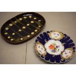 A nineteenth century Meissen porcelain plate, painted flowers, the royal blue rococo moulded border,