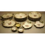 An early nineteenth century Meissen porcelain dessert service, hand painted coloured flowers with