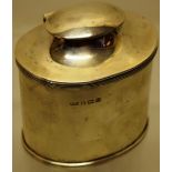 An oval silver tea caddy, the hinged cover with clip in caddy spoon, 3.5in (9cm) Maker George