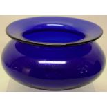 An early nineteenth century Bristol blue glass spitoon, with swelling sides, 7.5in (19cm) diameter