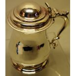 A George II ladys silver baluster lidded tankard, of pint capacity, the domed hinged cover with a