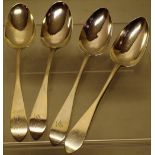 A set of four George III Scottish silver table spoons, with pointed end terminal handles, engraved