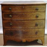 An early nineteenth century Channel Islands mahogany veneered bow front chest, inlaid stringing