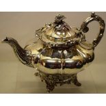 An early Victorian Scottish provincial silver teapot, everted melon panelled sides with a leaf and