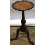 A mahogany Chippendale style wine table, the circular piecrust edge top, on a fluted stem with