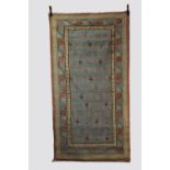 Khotan rug, east Turkestan, first half 20th century, 8ft. 3in. X 4ft. 4in. 2.51m. X 1.32m. Pale blue