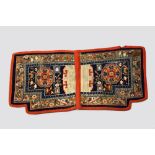 Tibetan saddle rug, inner Asia, early 20th century, 2ft. X 4ft. 2in. 0.61m. X 1.27m. Slight wear