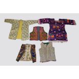 Five Ottoman and central Asian silk and metal thread embroidered clothing, 20th century,