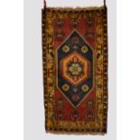 Four rugs, the first: Konya rug, central Anatolia, circa 1930s-40s, 6ft. 6in. X 3ft. 6in. 1.98m. X
