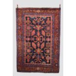 Hamadan rug, north west Persia, mid-20th century, 7ft. 1in. X 4ft. 10in. 2.16m. X 1.47m. Dark blue