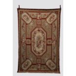 Needlework rug, probably Chinese, second half 20th century, 8ft. 6in.x 5ft. 6in. 2.59m. x 1.68m. Two