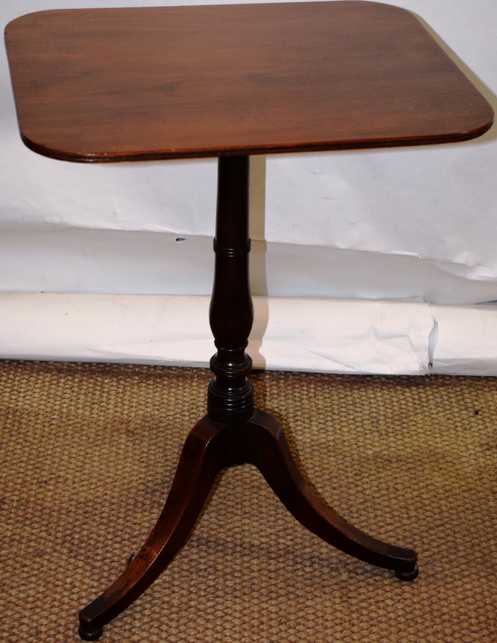 A Regency mahogany occasional table, the faded rectangular top with a fluted edge, the ring turned