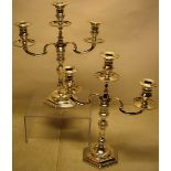 A pair of Irish cast silver candelabra, the twin scrolling branches with three moulded