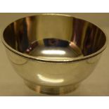 A Victorian silver sugar bowl, with a beaded edge rim, on a foot, Maker George Angell, London