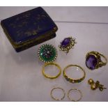 A Victorian amethyst ring, in a carved gold setting and a late Victorian gold ring, set small