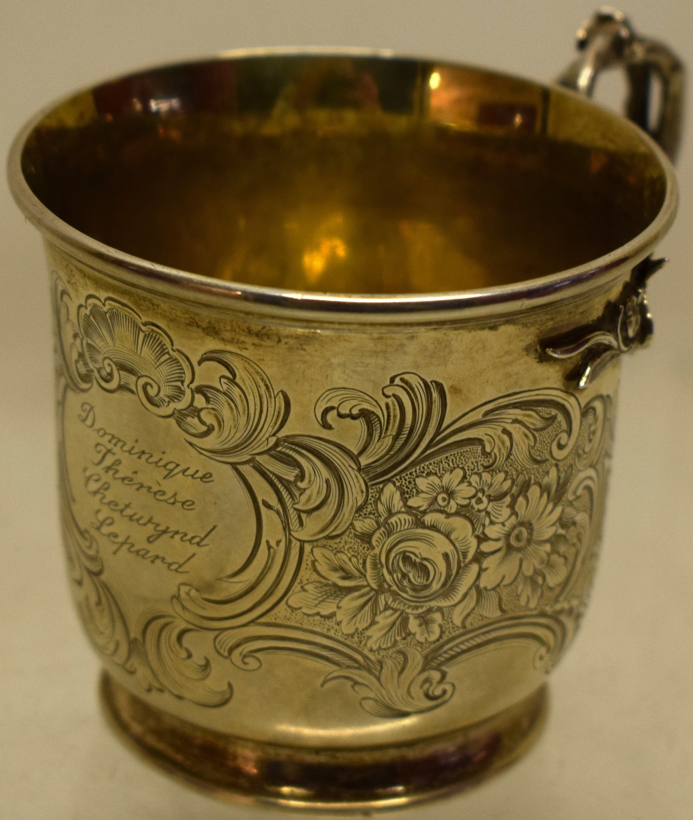 An early Victorian silver child's mug, engraved a named cartouche and scrolling foliage, a gilded