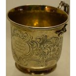 An early Victorian silver child's mug, engraved a named cartouche and scrolling foliage, a gilded