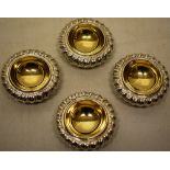 A set of four George IV silver circular trencher salts, with gadroon borders and gilded wells, Maker