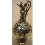 A Victorian Irish silver 'Armada' pattern mulled wine jug, with chased decoration applied make and
