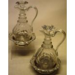 A pair of William IV panel cut glass wine jugs, with three ring necks and detachable stoppers,