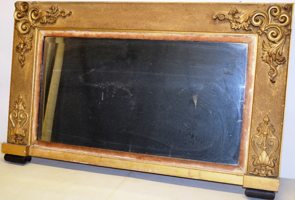 A George IV gilt frame landscape overmantle mirror, with a soft bevelled rectangular plate, the